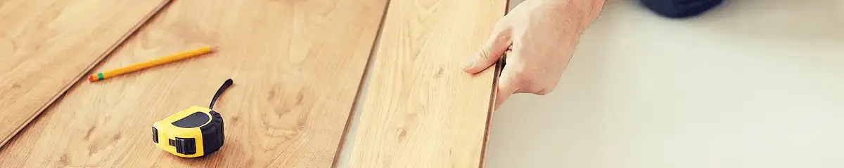 A professional installing wood flooring in Norfolk, VA