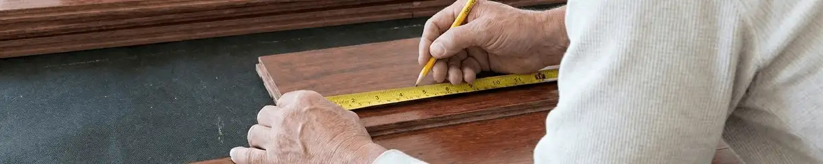 A professional installing wood flooring in Norfolk, VA